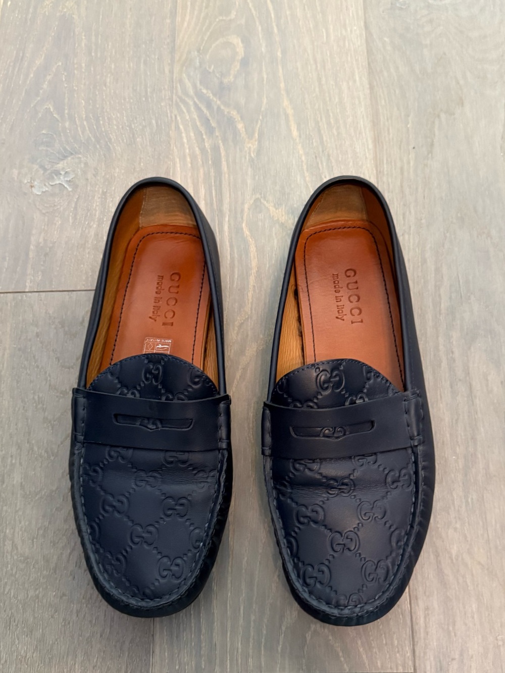 Gucci Men’s Navy Blue Embossed GG Leather Penny Loafers